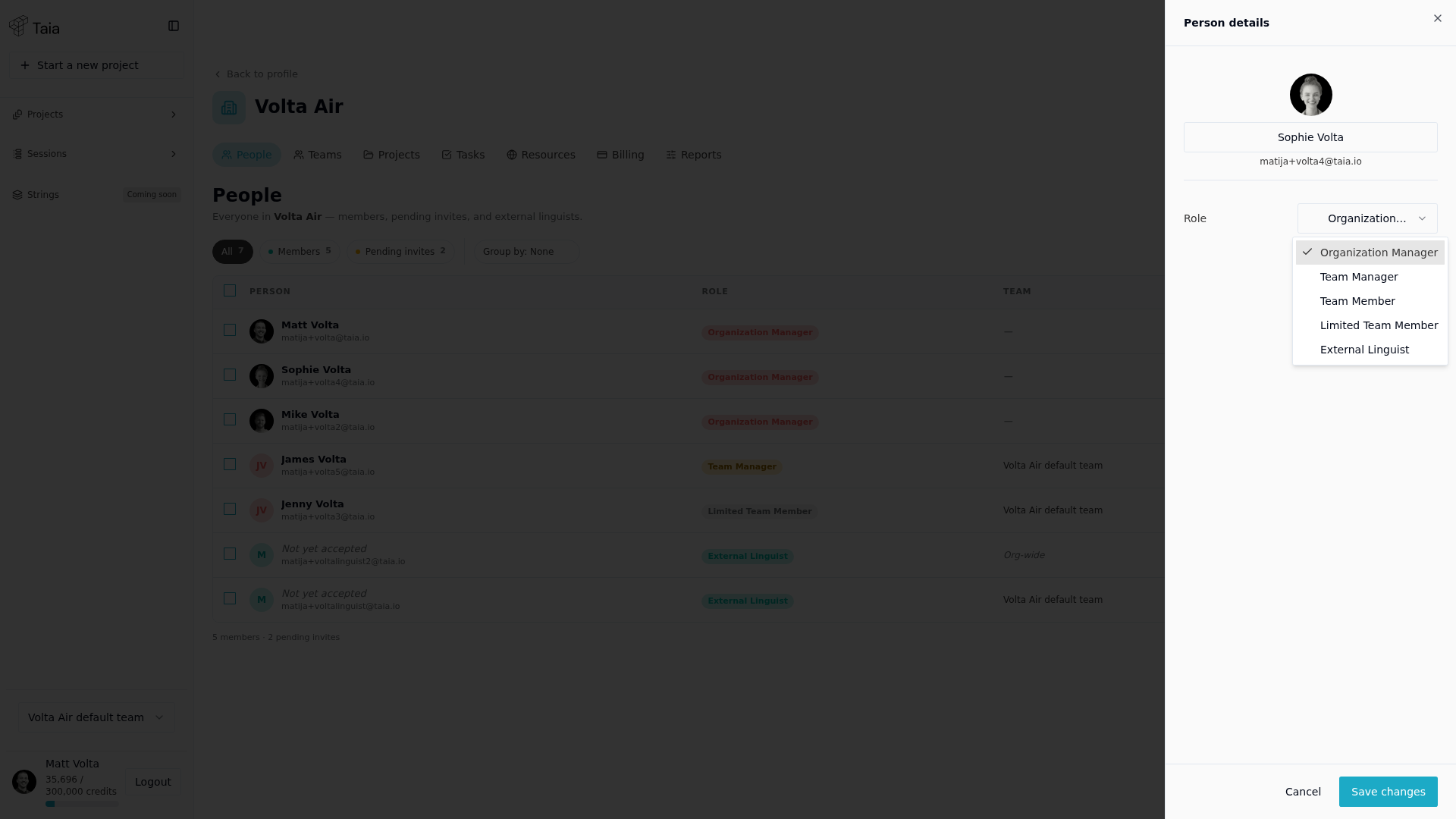 Role dropdown open in the Person details drawer — Organization Manager, Team Manager, Team Member, Limited Team Member, External Linguist